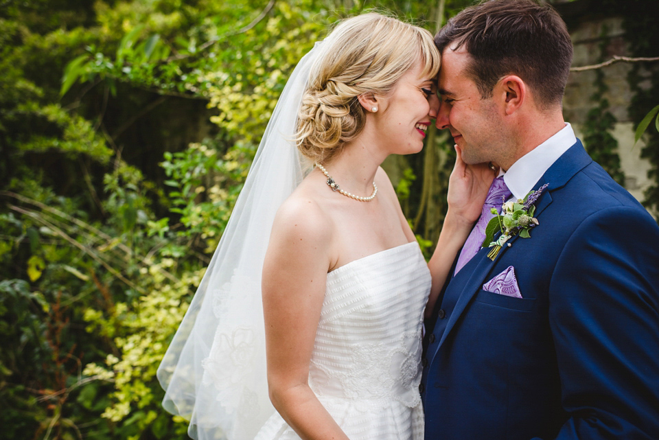 Green wedding shoes and a Jesus Peiro gown for this elegant wedding held at Fetcham Park in Surrey. Photography by Sophie Duckworth.