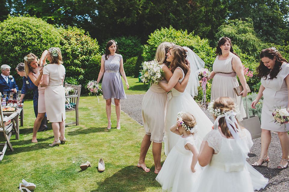 Wildflowers, a meadow, and and elegant Jesus Peiro gown for a handmade summer fete and festival inspired wedding. Photography by Simon Fazackarley.