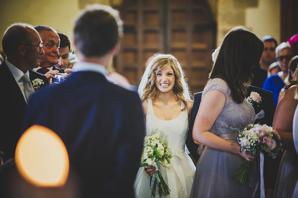 Wildflowers, a meadow, and and elegant Jesus Peiro gown for a handmade summer fete and festival inspired wedding. Photography by Simon Fazackarley.