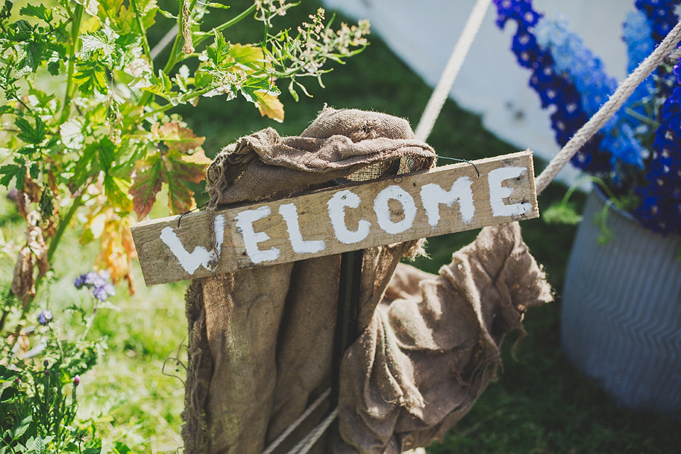 Wildflowers, a meadow, and and elegant Jesus Peiro gown for a handmade summer fete and festival inspired wedding. Photography by Simon Fazackarley.