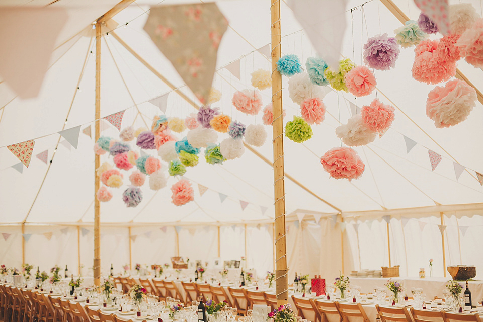 Wildflowers, a meadow, and and elegant Jesus Peiro gown for a handmade summer fete and festival inspired wedding. Photography by Simon Fazackarley.