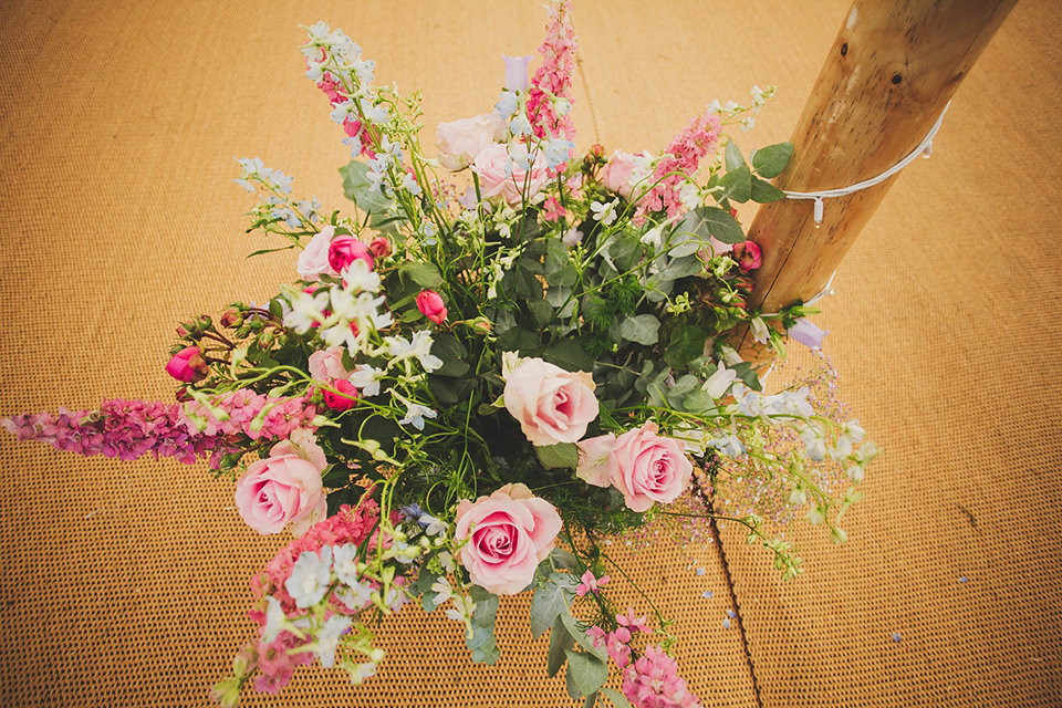 Wildflowers, a meadow, and and elegant Jesus Peiro gown for a handmade summer fete and festival inspired wedding. Photography by Simon Fazackarley.