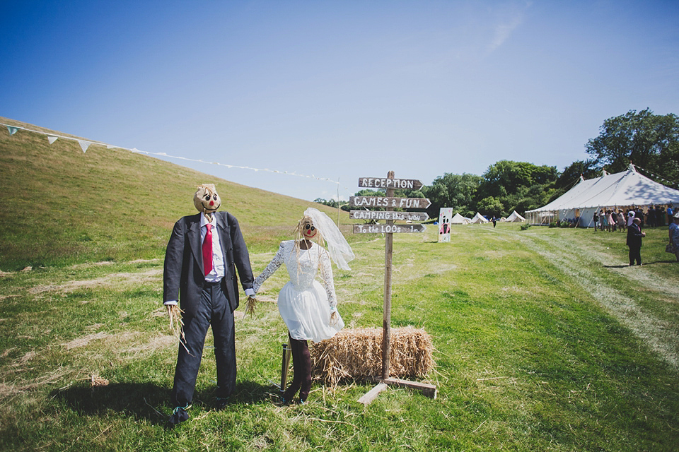 Wildflowers, a meadow, and and elegant Jesus Peiro gown for a handmade summer fete and festival inspired wedding. Photography by Simon Fazackarley.