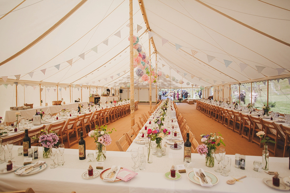 Wildflowers, a meadow, and and elegant Jesus Peiro gown for a handmade summer fete and festival inspired wedding. Photography by Simon Fazackarley.