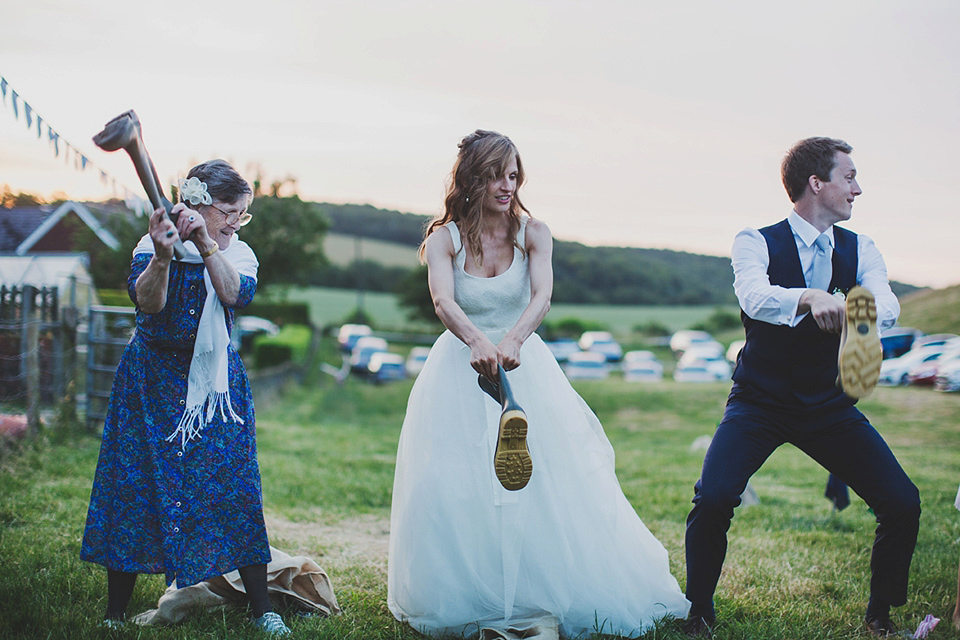 Wildflowers, a meadow, and and elegant Jesus Peiro gown for a handmade summer fete and festival inspired wedding. Photography by Simon Fazackarley.