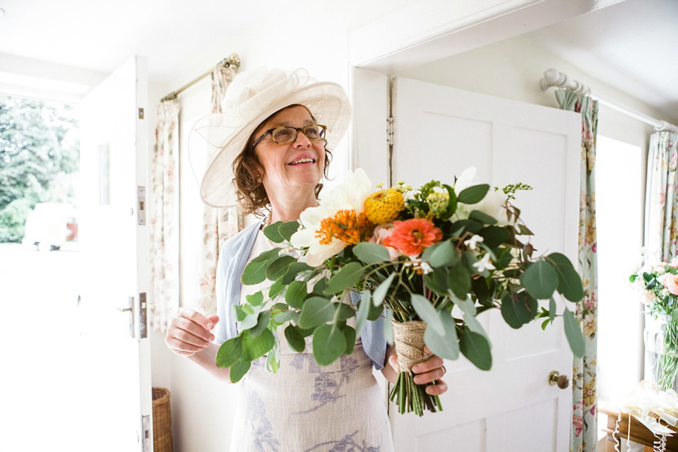 A laid back and colourful 1970's bohemian inspired wedding. Bride Helen wears a dress by Dana Bolton. Images by Horseshoe Photography.