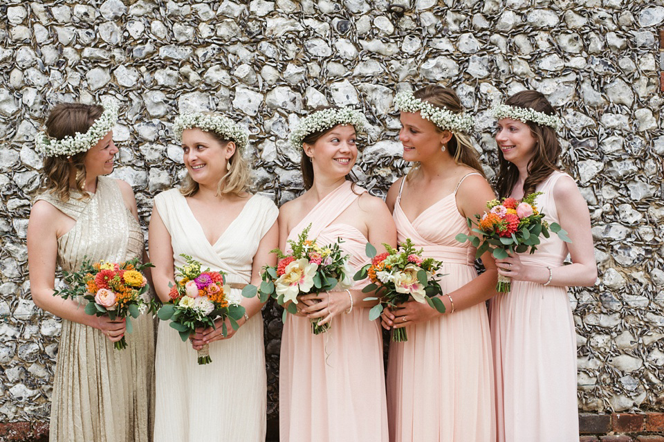 A laid back and colourful 1970's bohemian inspired wedding. Bride Helen wears a dress by Dana Bolton. Images by Horseshoe Photography.