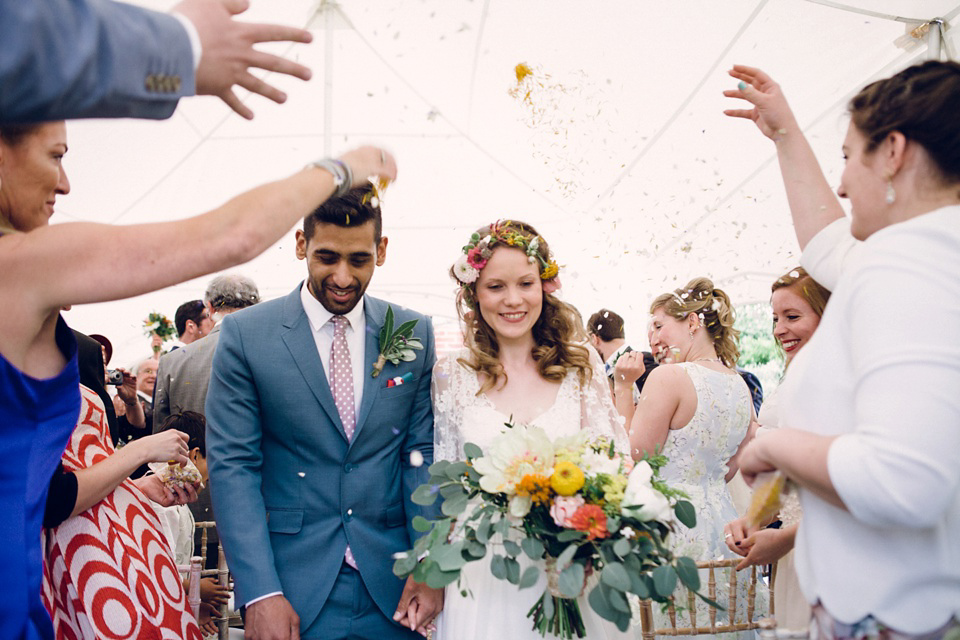 A laid back and colourful 1970's bohemian inspired wedding. Bride Helen wears a dress by Dana Bolton. Images by Horseshoe Photography.