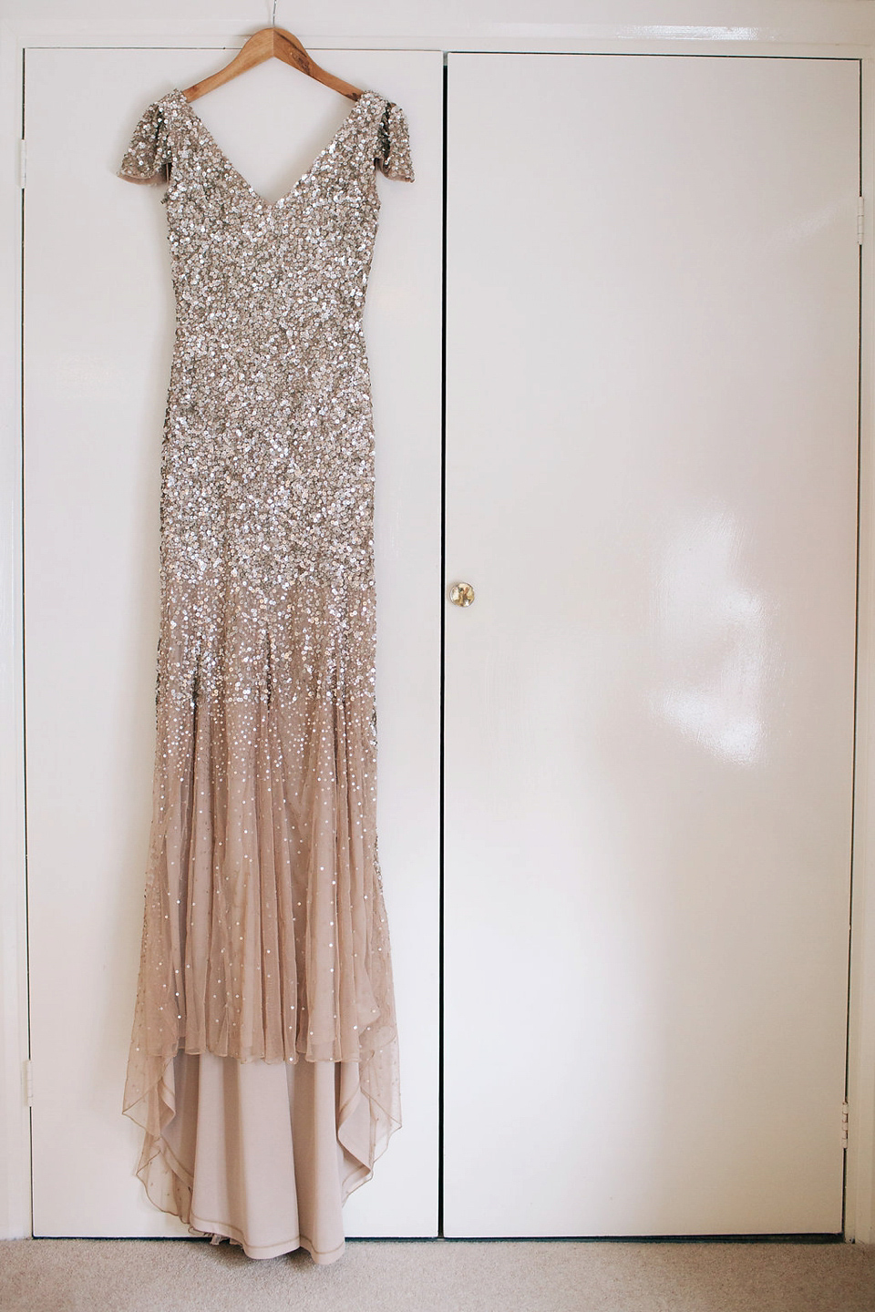 Sophie wears a gold, sequin Phase Eight gown for her wedding at The Norfolk Mead Hotel, an elegant Georgian boutique hotel in the heart of Norfolk. Photography by Joanna Millington.