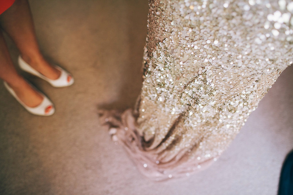 Sophie wears a gold, sequin Phase Eight gown for her wedding at The Norfolk Mead Hotel, an elegant Georgian boutique hotel in the heart of Norfolk. Photography by Joanna Millington.