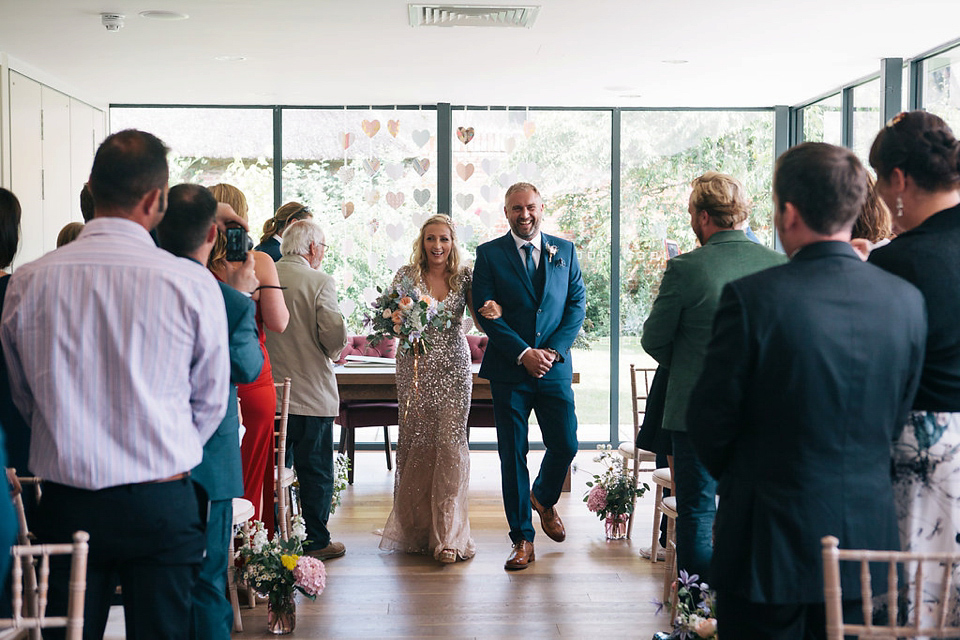 Sophie wears a gold, sequin Phase Eight gown for her wedding at The Norfolk Mead Hotel, an elegant Georgian boutique hotel in the heart of Norfolk. Photography by Joanna Millington.