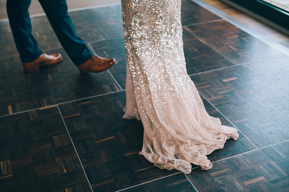 Sophie wears a gold, sequin Phase Eight gown for her wedding at The Norfolk Mead Hotel, an elegant Georgian boutique hotel in the heart of Norfolk. Photography by Joanna Millington.