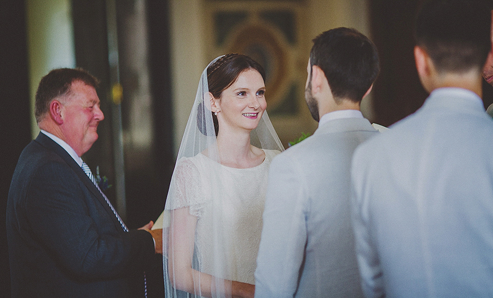 Bride Anna wore a Belle & Bunty gown that she purchased at Miss Bush Bridal of Surrey for her quirky London wedding. Photography by Howell Jones.