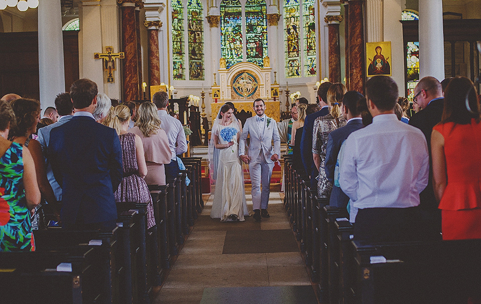 Bride Anna wore a Belle & Bunty gown that she purchased at Miss Bush Bridal of Surrey for her quirky London wedding. Photography by Howell Jones.