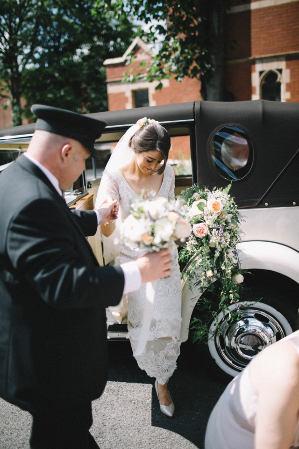 Bride Charlene wears a bespoke gown by Sheffield based designer, Kate Beaumont, for her wedding at Stockport Town Hall. Photography by DSB Creative.