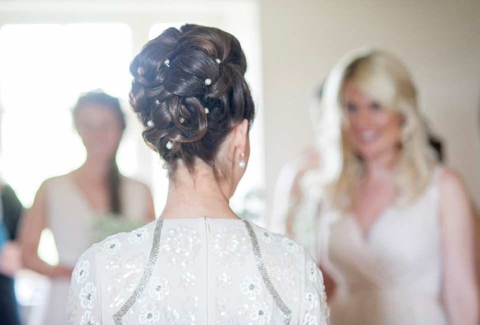 Bride Frances wears a gown by Needle & Thread for her Dewsall Court spring wedding. Images by Benjamin Wetherall of BPW Photography.