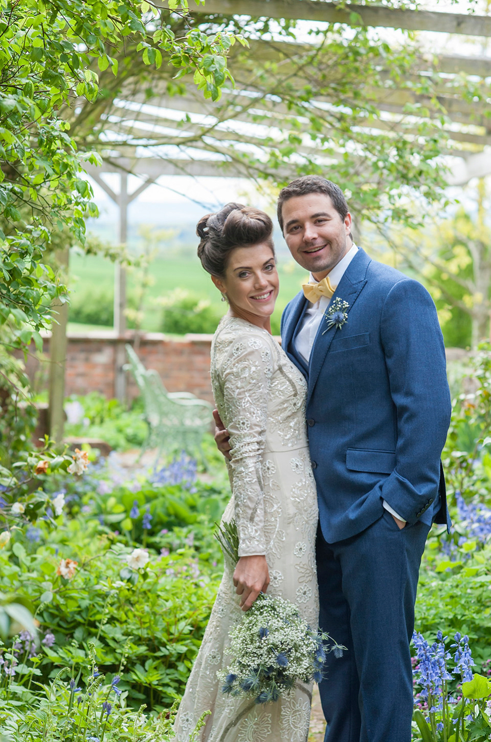 Bride Frances wears a gown by Needle & Thread for her Dewsall Court spring wedding. Images by Benjamin Wetherall of BPW Photography.