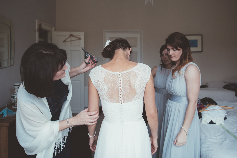 Lianne wears a Jesus Peiro gown for her family focussed wedding in The Cotswolds. Photography by Philippa James.