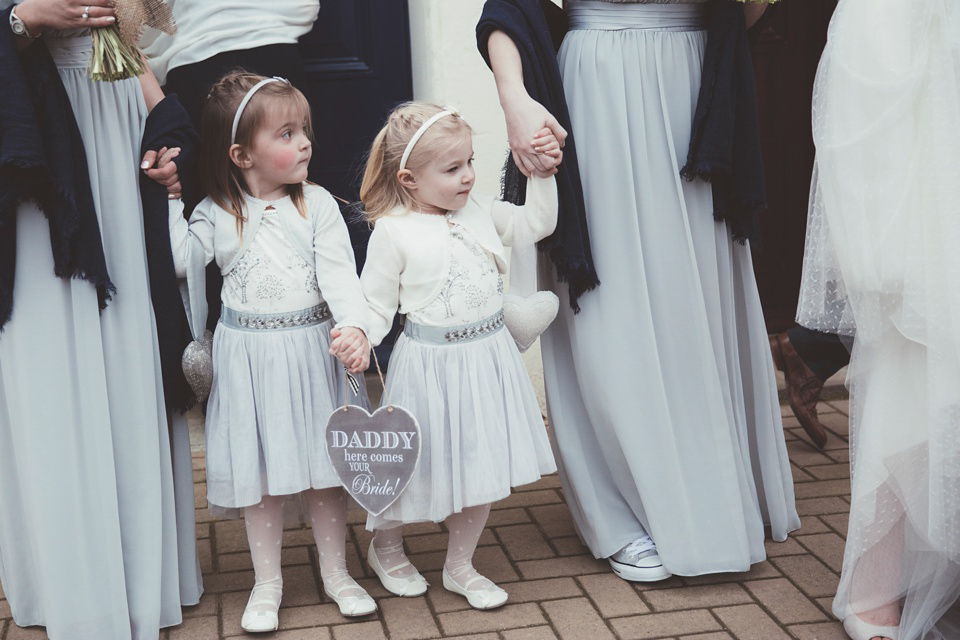 Lianne wears a Jesus Peiro gown for her family focussed wedding in The Cotswolds. Photography by Philippa James.