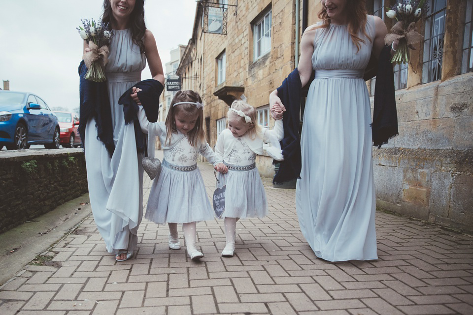 Lianne wears a Jesus Peiro gown for her family focussed wedding in The Cotswolds. Photography by Philippa James.