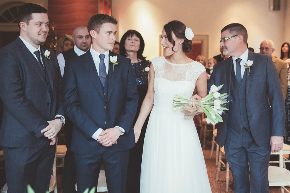 Lianne wears a Jesus Peiro gown for her family focussed wedding in The Cotswolds. Photography by Philippa James.