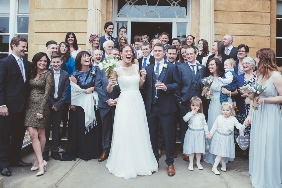 Lianne wears a Jesus Peiro gown for her family focussed wedding in The Cotswolds. Photography by Philippa James.