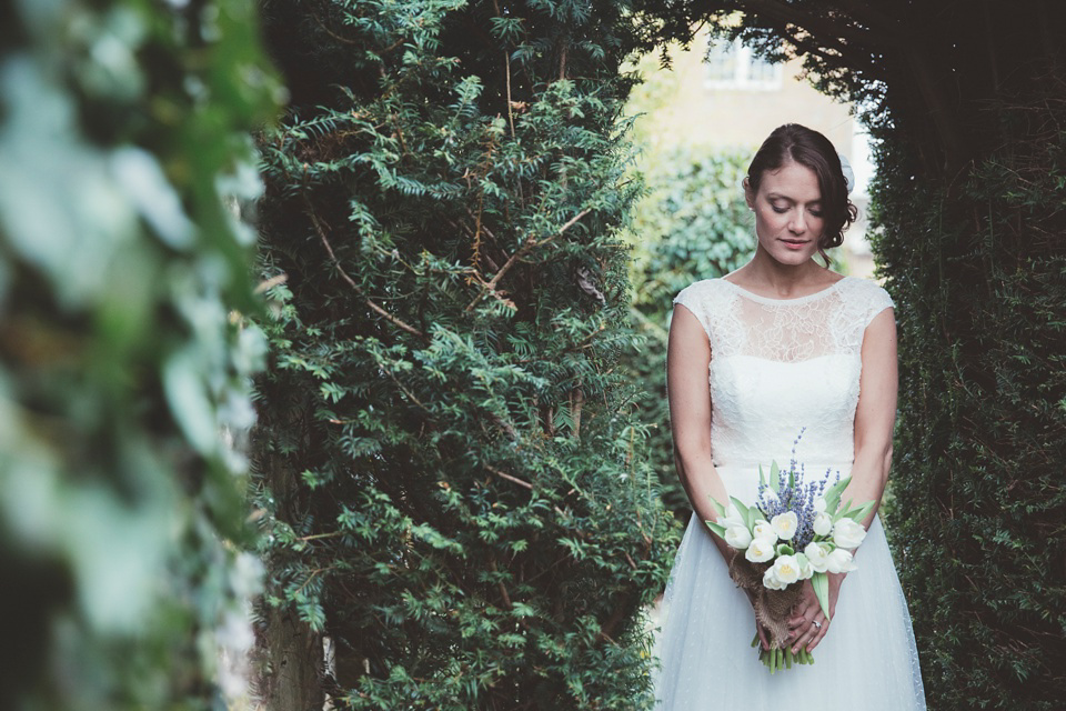 Lianne wears a Jesus Peiro gown for her family focussed wedding in The Cotswolds. Photography by Philippa James.