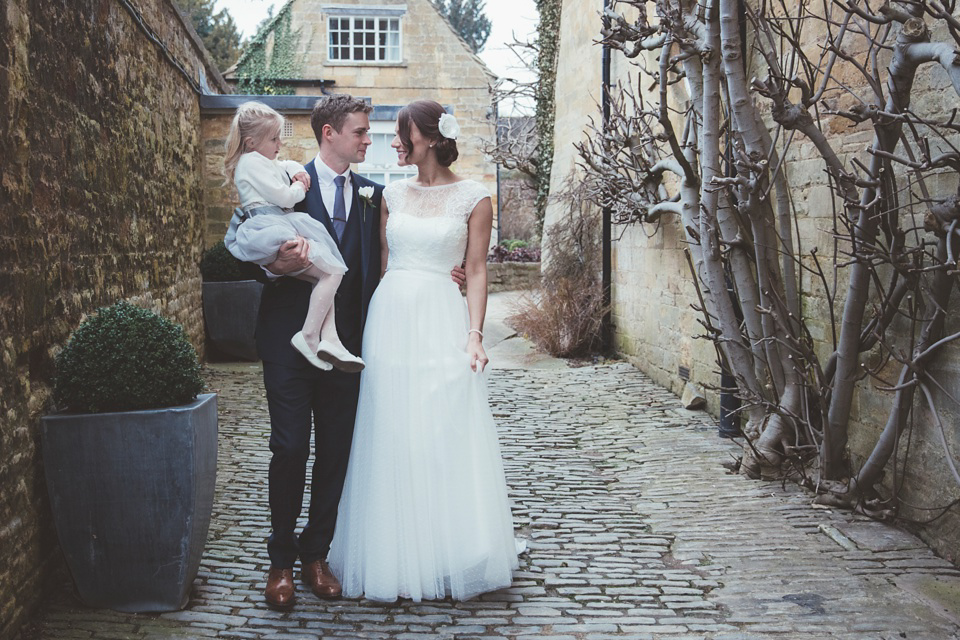 Lianne wears a Jesus Peiro gown for her family focussed wedding in The Cotswolds. Photography by Philippa James.