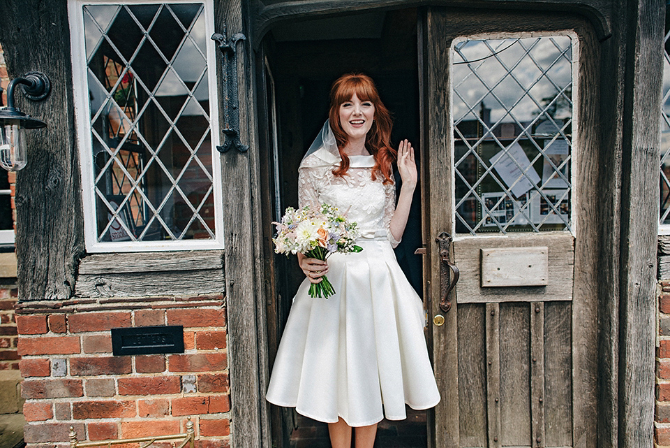 Bride Amy wears a replica 1960s wedding dress, designed by Fur Coat No Knickers of London, for her quirky and kitsch wedding. Photography by Jacqui McSweeney.