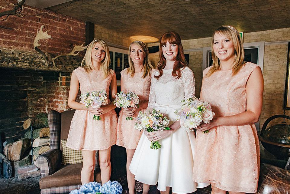 Bride Amy wears a replica 1960s wedding dress, designed by Fur Coat No Knickers of London, for her quirky and kitsch wedding. Photography by Jacqui McSweeney.