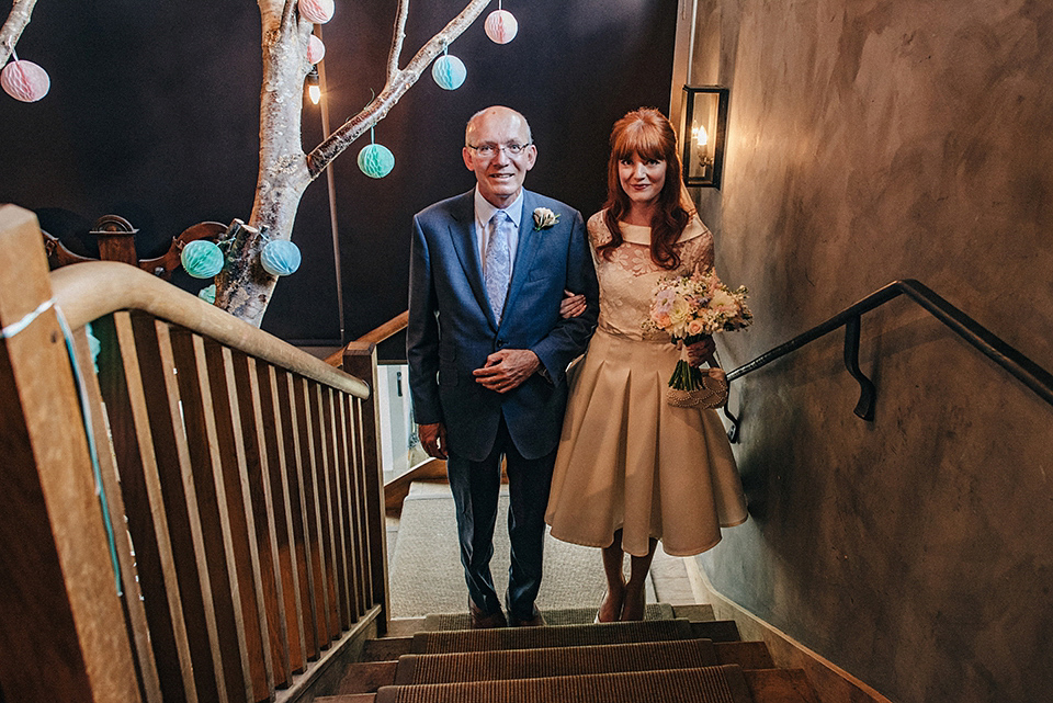 Bride Amy wears a replica 1960s wedding dress, designed by Fur Coat No Knickers of London, for her quirky and kitsch wedding. Photography by Jacqui McSweeney.