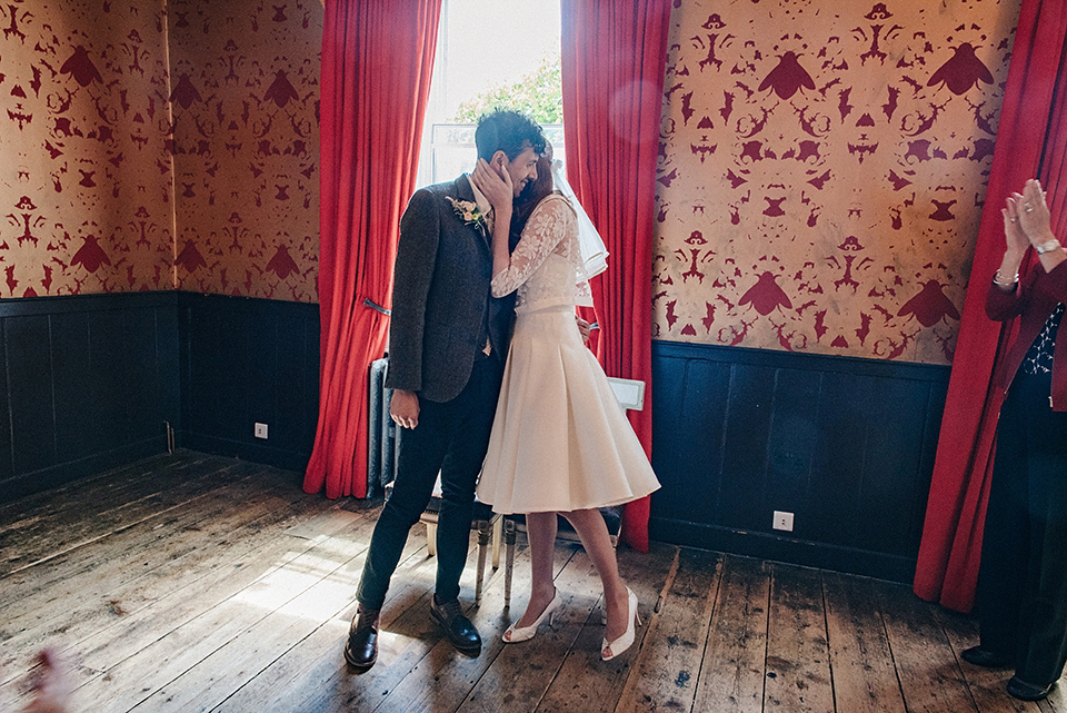 Bride Amy wears a replica 1960s wedding dress, designed by Fur Coat No Knickers of London, for her quirky and kitsch wedding. Photography by Jacqui McSweeney.