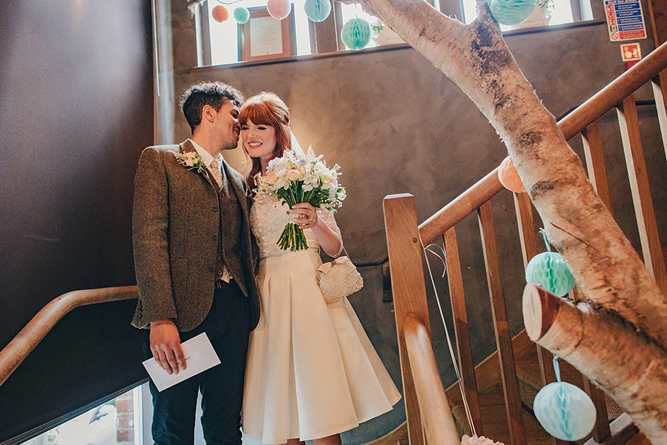 Bride Amy wears a replica 1960s wedding dress, designed by Fur Coat No Knickers of London, for her quirky and kitsch wedding. Photography by Jacqui McSweeney.