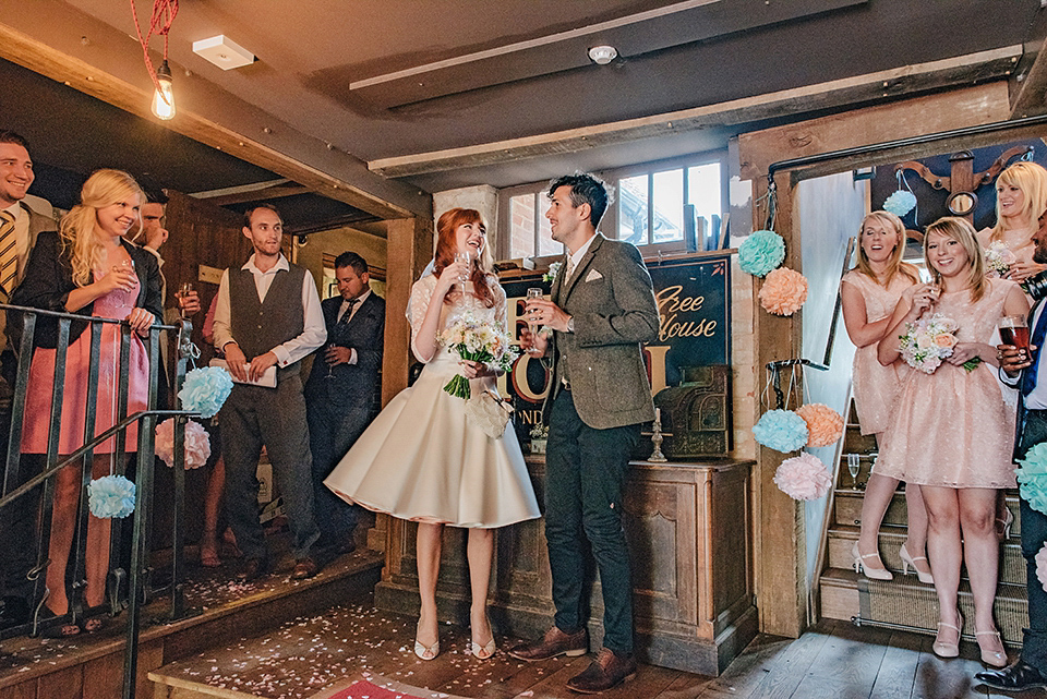 Bride Amy wears a replica 1960s wedding dress, designed by Fur Coat No Knickers of London, for her quirky and kitsch wedding. Photography by Jacqui McSweeney.