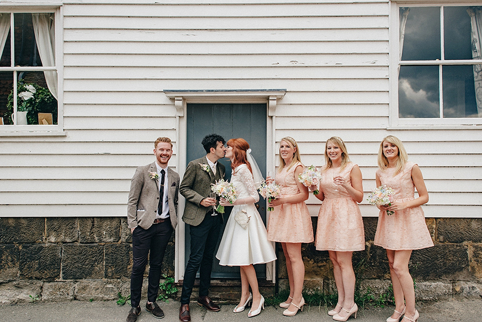 Bride Amy wears a replica 1960s wedding dress, designed by Fur Coat No Knickers of London, for her quirky and kitsch wedding. Photography by Jacqui McSweeney.