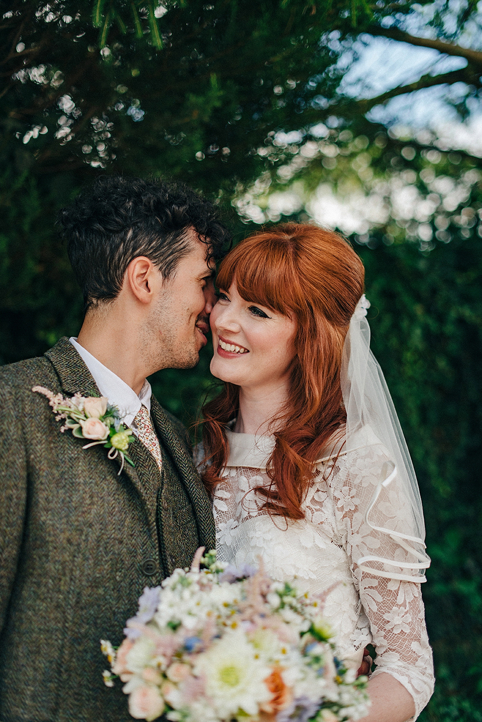 Bride Amy wears a replica 1960s wedding dress, designed by Fur Coat No Knickers of London, for her quirky and kitsch wedding. Photography by Jacqui McSweeney.