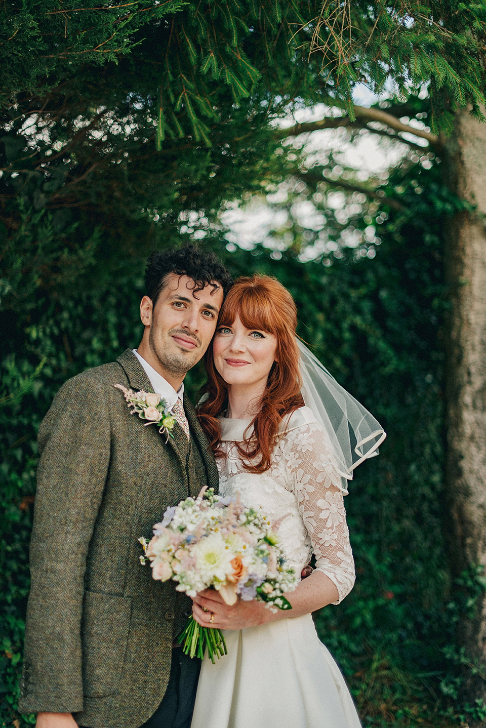 Bride Amy wears a replica 1960s wedding dress, designed by Fur Coat No Knickers of London, for her quirky and kitsch wedding. Photography by Jacqui McSweeney.