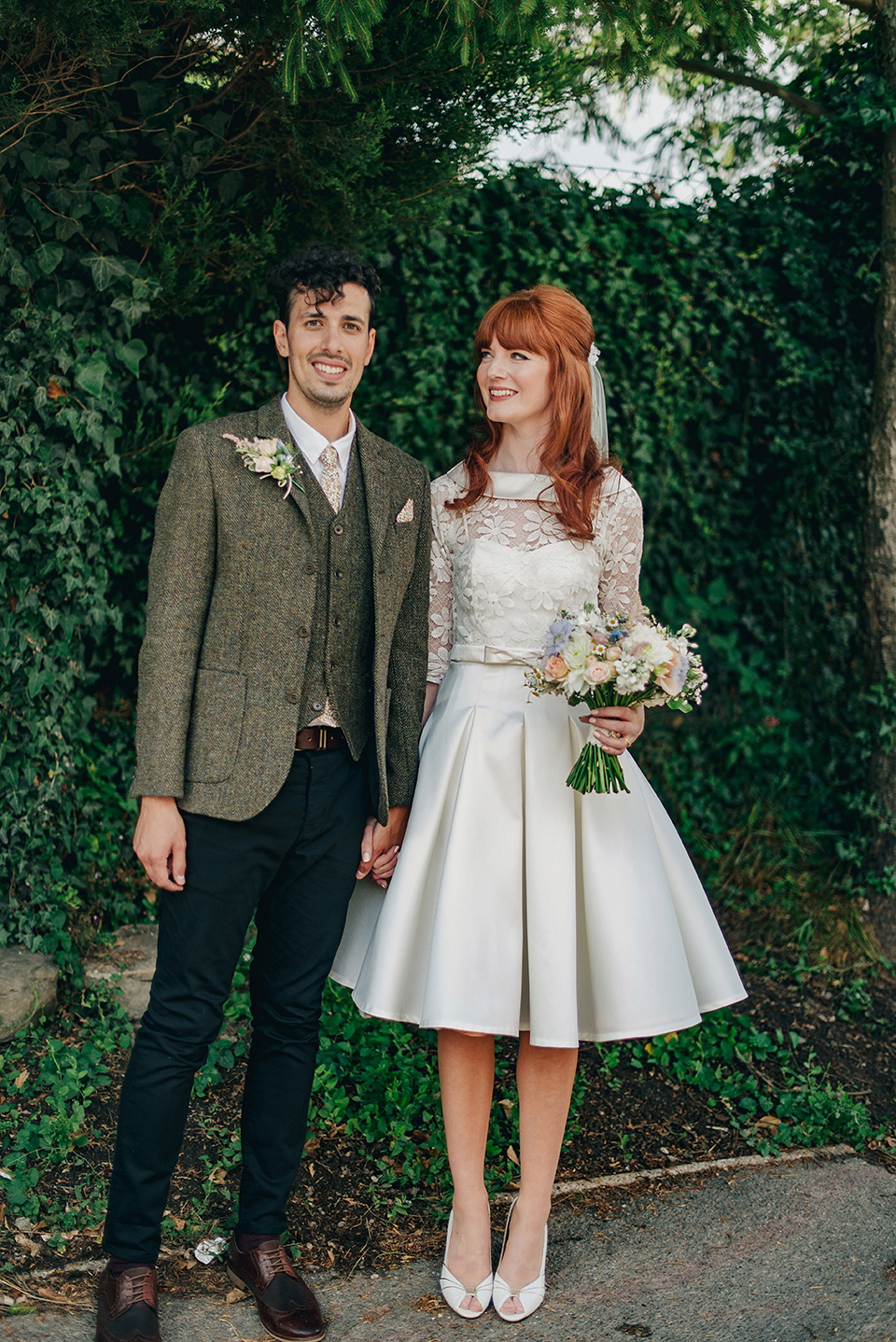 Bride Amy wears a replica 1960s wedding dress, designed by Fur Coat No Knickers of London, for her quirky and kitsch wedding. Photography by Jacqui McSweeney.