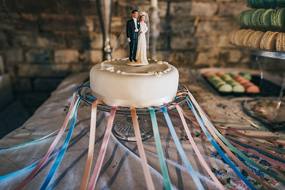 Bride Amy wears a replica 1960s wedding dress, designed by Fur Coat No Knickers of London, for her quirky and kitsch wedding. Photography by Jacqui McSweeney.