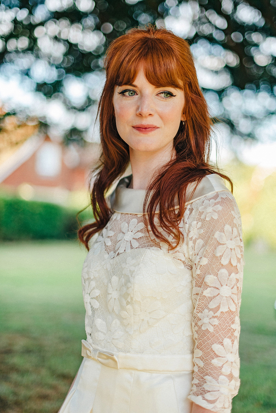 Bride Amy wears a replica 1960s wedding dress, designed by Fur Coat No Knickers of London, for her quirky and kitsch wedding. Photography by Jacqui McSweeney.