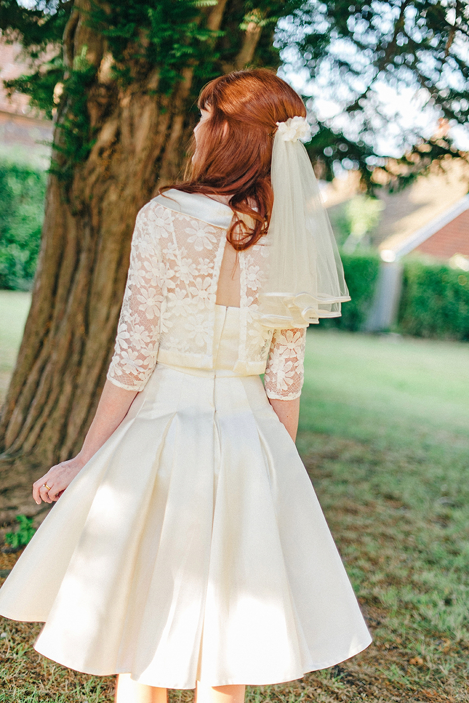 Bride Amy wears a replica 1960s wedding dress, designed by Fur Coat No Knickers of London, for her quirky and kitsch wedding. Photography by Jacqui McSweeney.