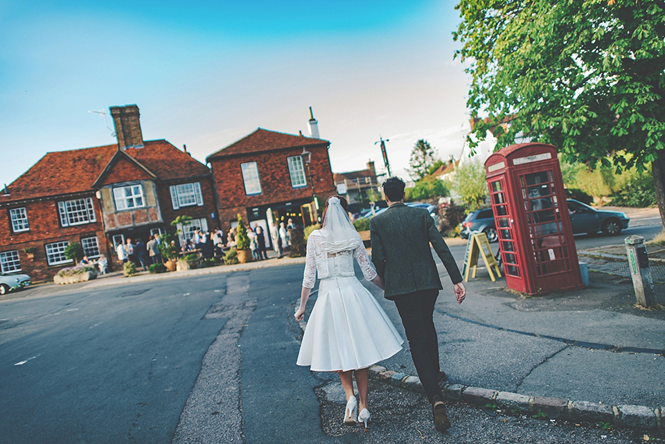 Bride Amy wears a replica 1960s wedding dress, designed by Fur Coat No Knickers of London, for her quirky and kitsch wedding. Photography by Jacqui McSweeney.