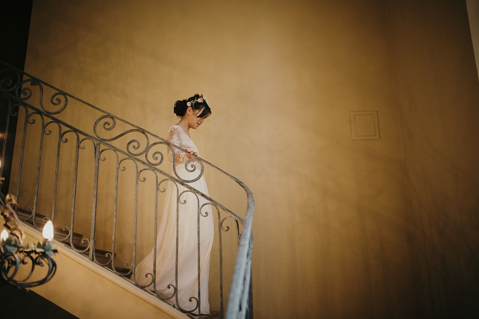 A first look and floral crown for an elegant and intimate chateau wedding in the South of France. Photography by Sabestien Boudot.