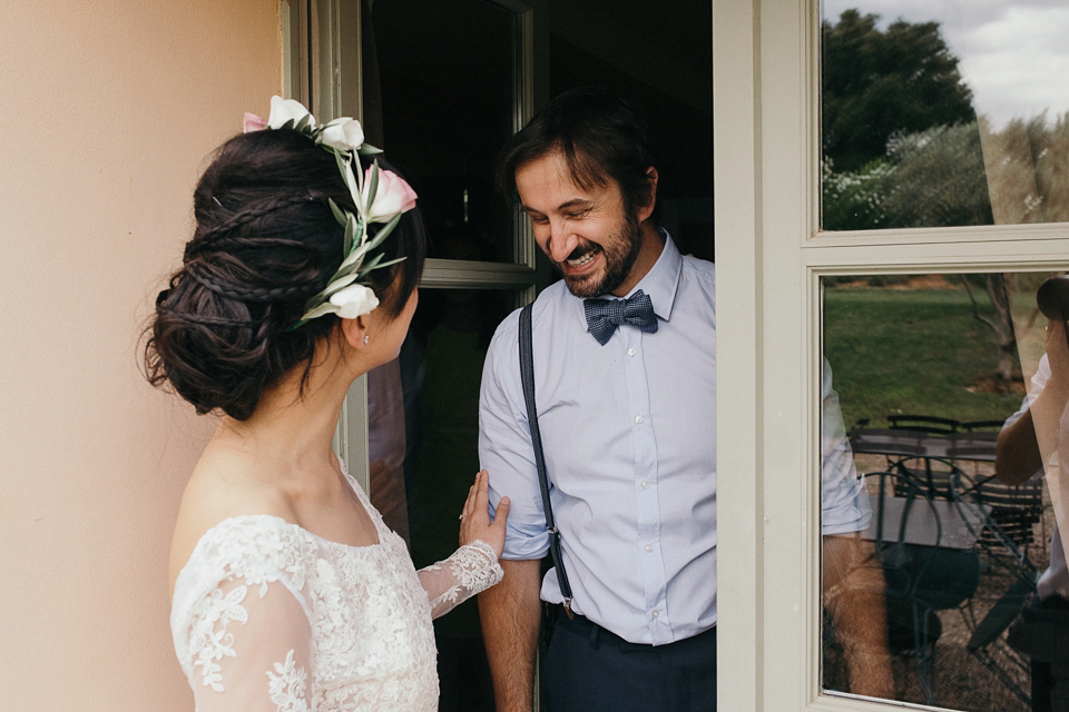 A first look and floral crown for an elegant and intimate chateau wedding in the South of France. Photography by Sabestien Boudot.