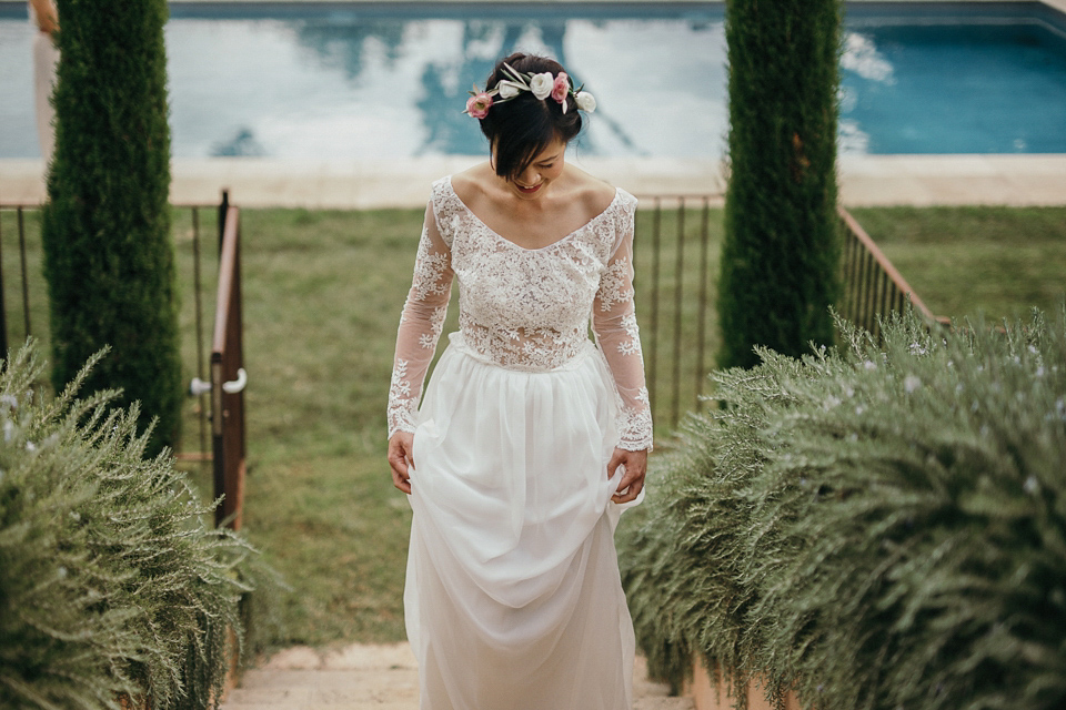 A first look and floral crown for an elegant and intimate chateau wedding in the South of France. Photography by Sabestien Boudot.