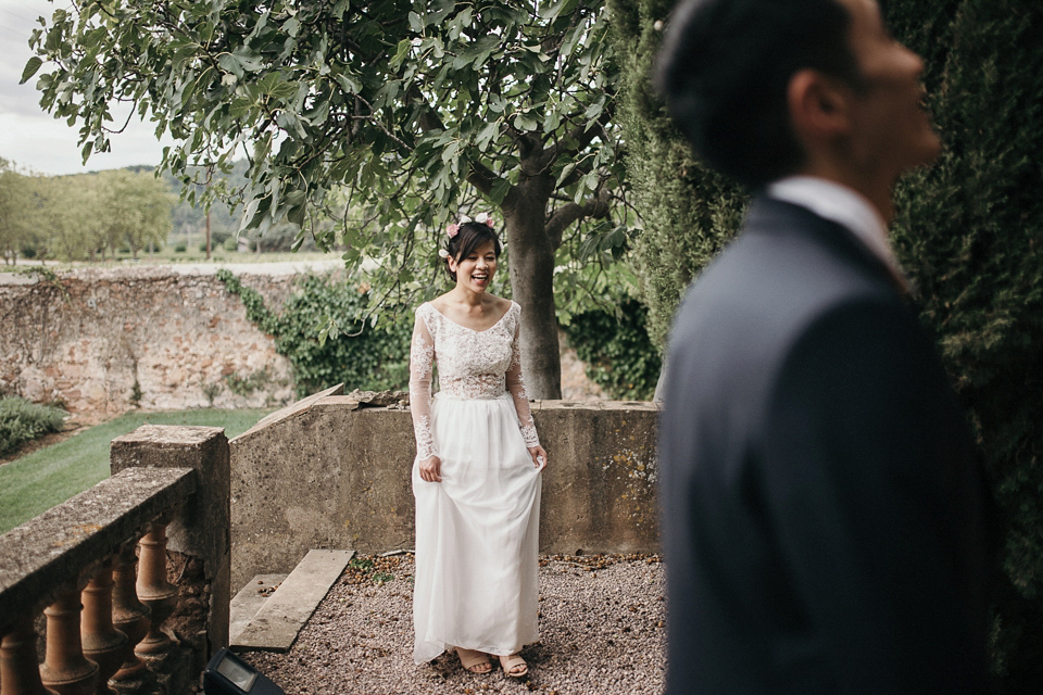 A first look and floral crown for an elegant and intimate chateau wedding in the South of France. Photography by Sabestien Boudot.