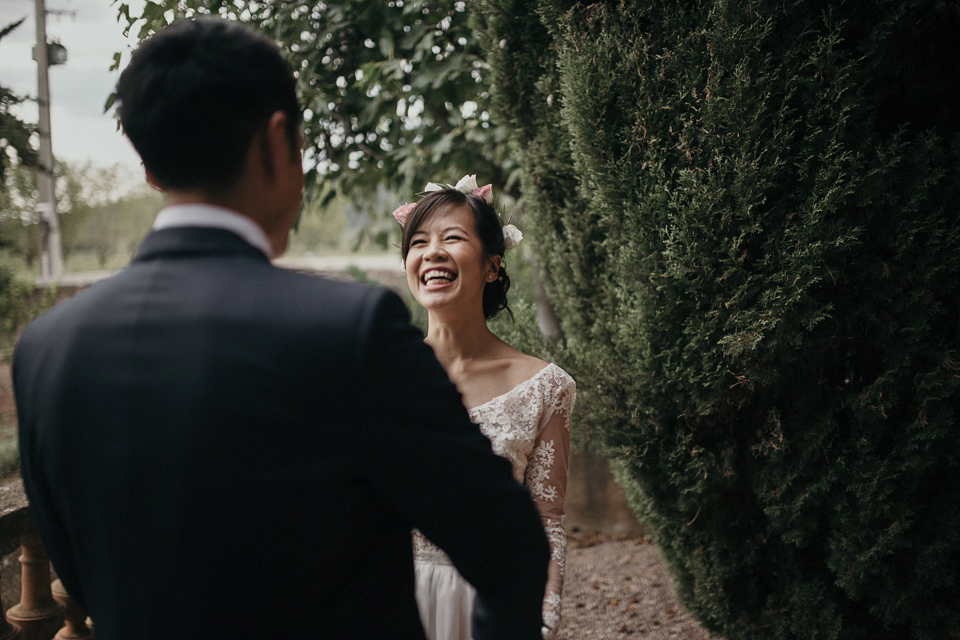 A first look and floral crown for an elegant and intimate chateau wedding in the South of France. Photography by Sabestien Boudot.