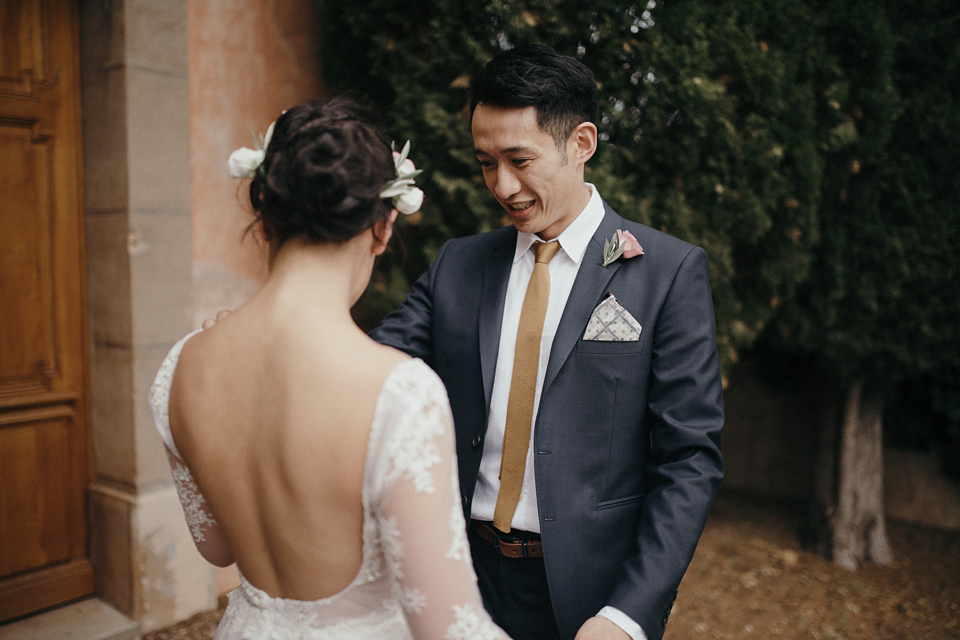 A first look and floral crown for an elegant and intimate chateau wedding in the South of France. Photography by Sabestien Boudot.