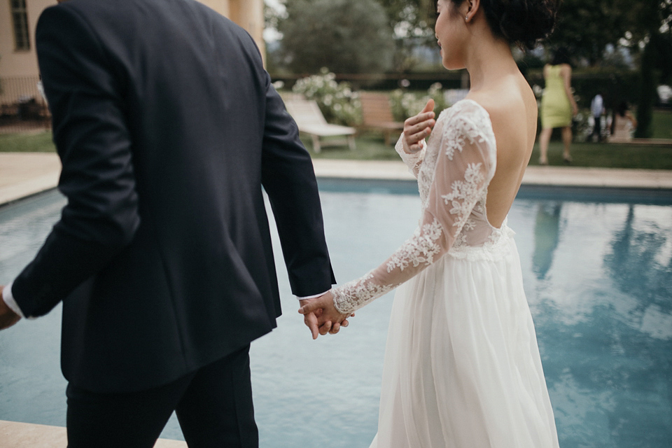 A first look and floral crown for an elegant and intimate chateau wedding in the South of France. Photography by Sabestien Boudot.