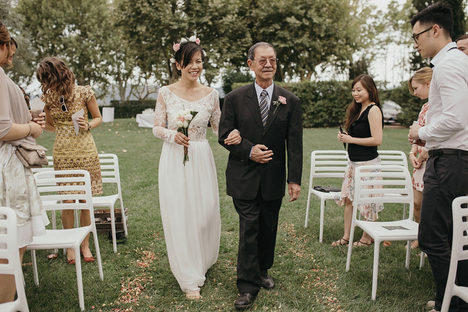 A first look and floral crown for an elegant and intimate chateau wedding in the South of France. Photography by Sabestien Boudot.